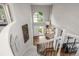 Grand foyer with a soaring ceiling, chandelier, staircase, and views of the entry at 9552 E Caley Cir, Englewood, CO 80111