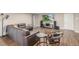 Large living room with hardwood floors, stylish seating and media center at 9552 E Caley Cir, Englewood, CO 80111