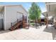 Backyard with outbuilding featuring stairs, door, and patio area, perfect for outdoor relaxation and entertainment at 250 W Midway Blvd, Broomfield, CO 80020