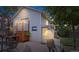 A nighttime shot of the backyard featuring a detached garage, staircase, and patio at 250 W Midway Blvd, Broomfield, CO 80020