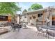 A backyard with a fire pit, patio, seating, and mature trees creating a perfect spot for outdoor gatherings at 250 W Midway Blvd, Broomfield, CO 80020