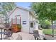 Backyard with a patio area and detached garage, complete with a charming staircase and Colorado flag decor at 250 W Midway Blvd, Broomfield, CO 80020