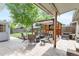 Inviting outdoor patio featuring comfortable seating, a fire pit, and lush greenery, perfect for relaxation and entertainment at 250 W Midway Blvd, Broomfield, CO 80020