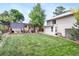 Expansive backyard featuring a well-maintained lawn, a charming pergola, and a patio area perfect for outdoor entertaining at 250 W Midway Blvd, Broomfield, CO 80020