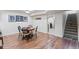 Basement featuring a dining area and access to a laundry room and carpeted staircase to the upper level at 250 W Midway Blvd, Broomfield, CO 80020