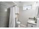 Bathroom showcasing tiled shower, modern vanity with granite countertop, and a window for natural light at 250 W Midway Blvd, Broomfield, CO 80020