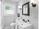 Bright bathroom features a modern vanity, updated fixtures and lots of natural light at 250 W Midway Blvd, Broomfield, CO 80020