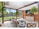 Outdoor patio featuring comfortable seating, a pergola, a TV, and a well-maintained backyard for relaxation at 250 W Midway Blvd, Broomfield, CO 80020
