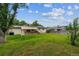 Expansive backyard with a wooden deck and awning, perfect for outdoor enjoyment at 6508 S Garland Way, Littleton, CO 80123