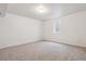 Basement bedroom with carpet flooring and natural light from a window, perfect for guests at 6508 S Garland Way, Littleton, CO 80123