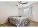 Cozy bedroom with carpet, a ceiling fan, and bright window at 6508 S Garland Way, Littleton, CO 80123