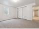 Bright bedroom with a window and closet, offering a serene and minimalist design at 6508 S Garland Way, Littleton, CO 80123