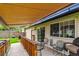 Cozy covered patio featuring outdoor seating, perfect for relaxing and entertaining guests at 6508 S Garland Way, Littleton, CO 80123