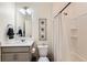 Bright, clean bathroom with a shower, a vanity with a white countertop and chrome hardware at 1005 Ryland Rd, Brighton, CO 80603