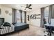 Bedroom with cozy carpet, a comfortable bed, natural light, and stylish decor for a relaxing retreat at 1005 Ryland Rd, Brighton, CO 80603