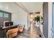 Stylish foyer with hardwood floors, decorative accents, and a view of the open-concept living spaces at 1005 Ryland Rd, Brighton, CO 80603