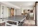 Finished basement offering a kitchenette, ping pong table and recreational area at 11980 Swansea Dr, Parker, CO 80134