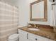 Bathroom featuring a granite countertop and shower with striped curtain at 11980 Swansea Dr, Parker, CO 80134