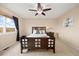 Bedroom with carpeted floor, ceiling fan, and large window with natural light at 11980 Swansea Dr, Parker, CO 80134