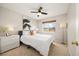 Bedroom featuring a ceiling fan, neutral decor and window with natural light at 11980 Swansea Dr, Parker, CO 80134