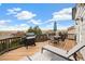 Outdoor deck area featuring a grill, outdoor furniture, seating, and scenic views at 11980 Swansea Dr, Parker, CO 80134
