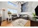 Spacious living room with high ceilings, a large window with natural light, and a comfortable leather sectional at 11980 Swansea Dr, Parker, CO 80134