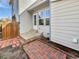 Back patio of the house showing clean, modern lines and the wooden fence in the background at 6852 S Dover Way, Littleton, CO 80128