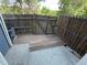Enclosed back patio area with wooden deck and privacy fence at 2280 S Jasper Way # A, Aurora, CO 80013