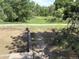 Picture of a backyard with green scenery beyond a grassy area at 2280 S Jasper Way # A, Aurora, CO 80013