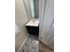 Small bathroom featuring modern vanity, mirror, and stylish patterned floor tiles at 2280 S Jasper Way # A, Aurora, CO 80013