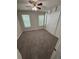 Cozy bedroom featuring neutral carpet, a closet, and windows that let in natural light at 2280 S Jasper Way # A, Aurora, CO 80013