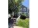 Charming two-story home with blue siding, green lawn, and steps leading up to the front door at 2280 S Jasper Way # A, Aurora, CO 80013