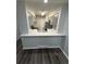 An updated, neutral colored kitchen with modern appliances and a breakfast bar at 2280 S Jasper Way # A, Aurora, CO 80013
