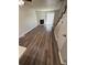 Spacious living room with a stone fireplace, wood-style flooring, and a staircase at 2280 S Jasper Way # A, Aurora, CO 80013