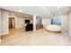 Finished basement with recessed lighting, wood flooring, a large window and a comfortable seating area with a TV at 4970 Laurelglen Ln, Highlands Ranch, CO 80130