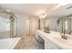 Bathroom featuring a walk-in shower and double sink vanity at 4970 Laurelglen Ln, Highlands Ranch, CO 80130