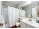 Clean bathroom with a shower, vanity, and decorative mirror providing both functionality and style at 4970 Laurelglen Ln, Highlands Ranch, CO 80130