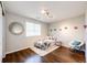 Bedroom with light colored walls and hardwood floors at 4970 Laurelglen Ln, Highlands Ranch, CO 80130