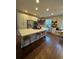 Spacious kitchen with a large island, stainless steel appliances, and hardwood floors at 4970 Laurelglen Ln, Highlands Ranch, CO 80130