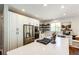 Bright kitchen featuring a large island, quartz countertops, stainless appliances, and hardwood floors at 4970 Laurelglen Ln, Highlands Ranch, CO 80130