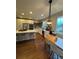 Bright and airy kitchen with a large island, stainless steel appliances, and breakfast nook at 4970 Laurelglen Ln, Highlands Ranch, CO 80130