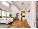 Bright living room with high ceilings, hardwood floors, large windows and modern furnishings at 4970 Laurelglen Ln, Highlands Ranch, CO 80130
