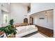 Bright living room with high ceilings, hardwood floors, many windows and stylish furnishings at 4970 Laurelglen Ln, Highlands Ranch, CO 80130