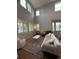 Bright living room with hardwood floors, high ceilings, and large windows at 4970 Laurelglen Ln, Highlands Ranch, CO 80130