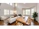 Elegant living room featuring a high ceiling, many windows, and an open floor plan at 4970 Laurelglen Ln, Highlands Ranch, CO 80130
