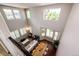 Aerial view of the home's living room and dining areas, showcasing the open floor plan and abundant natural light at 4970 Laurelglen Ln, Highlands Ranch, CO 80130