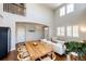Spacious living room showcasing hardwood floors, arched doorways and an open design at 4970 Laurelglen Ln, Highlands Ranch, CO 80130