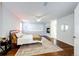 Serene main bedroom with a fireplace, hardwood floors, and ample natural light creating a relaxing atmosphere at 4970 Laurelglen Ln, Highlands Ranch, CO 80130