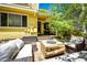Inviting patio space with comfortable seating and a unique wood-style coffee table, perfect for outdoor relaxation at 4970 Laurelglen Ln, Highlands Ranch, CO 80130