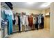 Spacious walk-in closet with ample hanging and shelving space for storage at 4970 Laurelglen Ln, Highlands Ranch, CO 80130